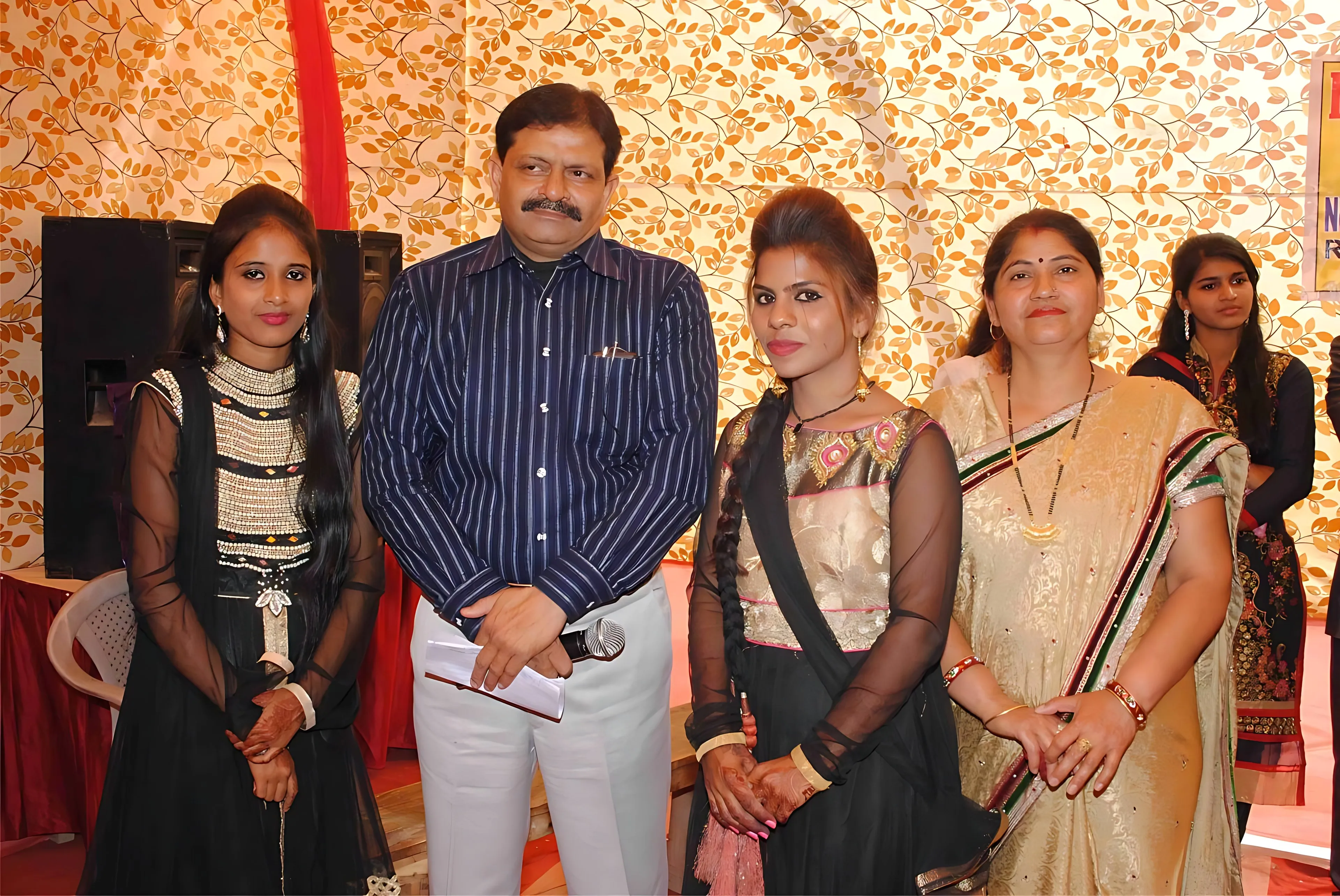 The Director with members of staff at a school function